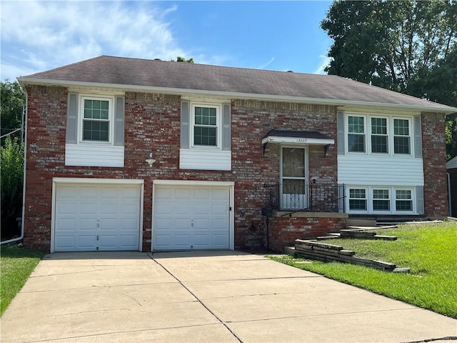 15007 E 41st St, Independence, MO 64055 - raised ranch with driveway, an attached garage, brick siding, and a shingled roof