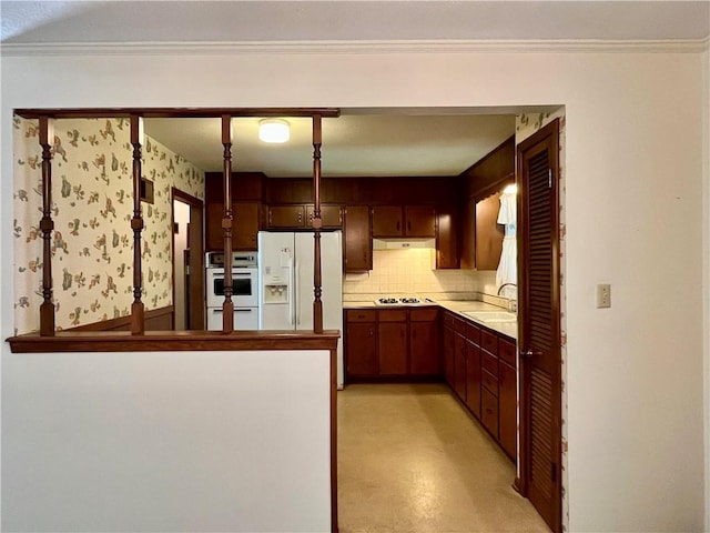 15007 E 41st St, Independence, MO 64055 - kitchen featuring under cabinet range hood, white appliances, tasteful backsplash, light countertops, and ornamental molding