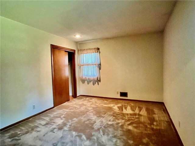 15007 E 41st St, Independence, MO 64055 - unfurnished bedroom featuring carpet and a closet