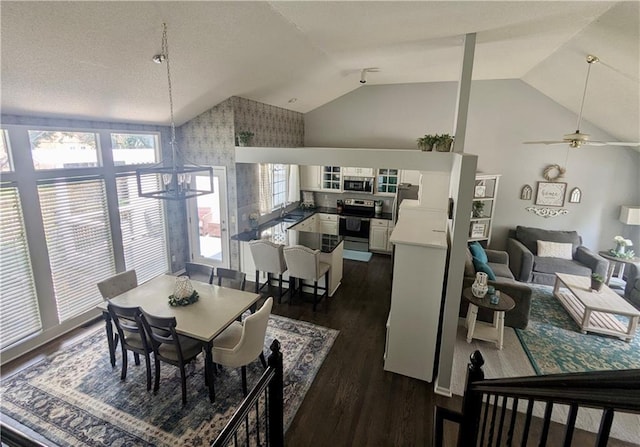 22030 W 51st Ter, Shawnee, KS 66226 - dining room featuring vaulted ceiling, dark wood-style flooring, and ceiling fan