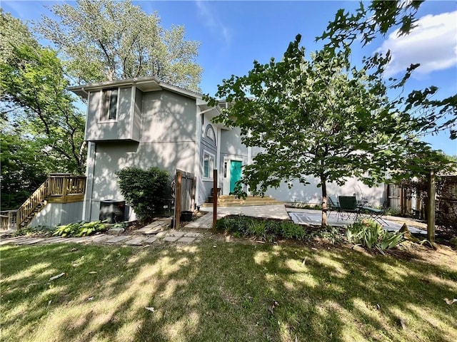 2811 Chatelain Ct Unit A, Independence, MO 64057 - rear view of house with a lawn, stairway, a patio area, and a deck