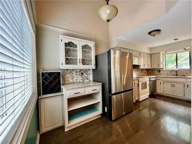 2811 Chatelain Ct Unit A, Independence, MO 64057 - kitchen with stainless steel appliances, backsplash, and dark wood-type flooring