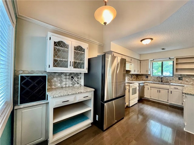 2811 Chatelain Ct Unit A, Independence, MO 64057 - kitchen with open shelves, appliances with stainless steel finishes, backsplash, dark wood-type flooring, and crown molding