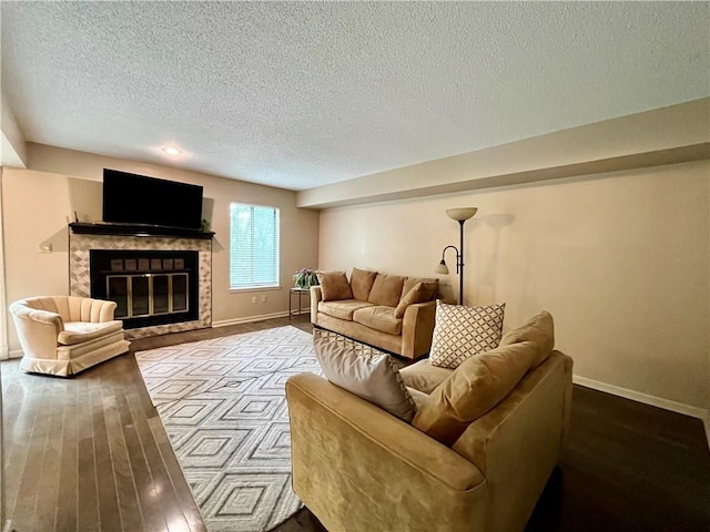 2811 Chatelain Ct Unit A, Independence, MO 64057 - living area featuring a textured ceiling, a tiled fireplace, and wood finished floors