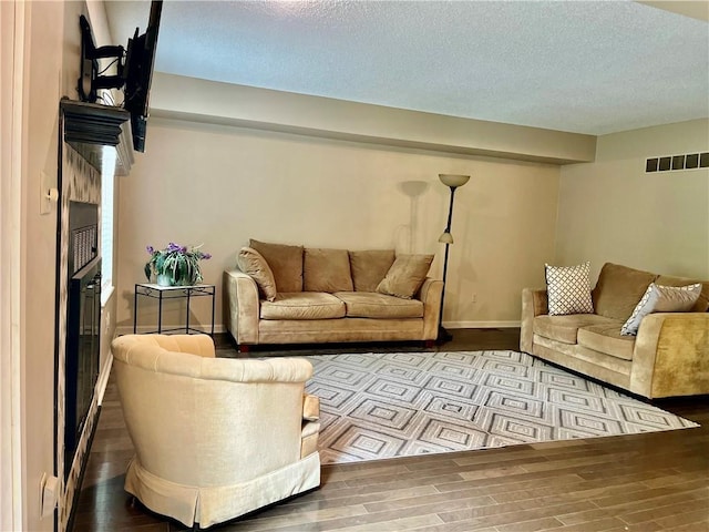 2811 Chatelain Ct Unit A, Independence, MO 64057 - living area with wood finished floors and a textured ceiling