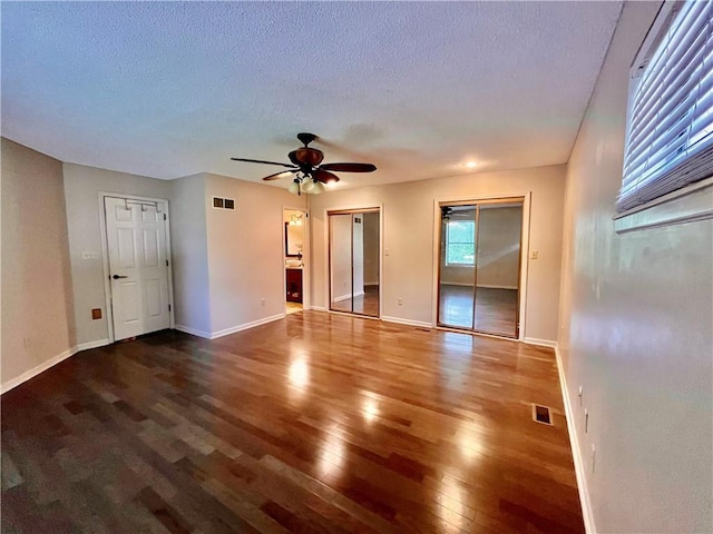 2811 Chatelain Ct Unit A, Independence, MO 64057 - unfurnished room featuring wood finished floors, a ceiling fan, and a textured ceiling