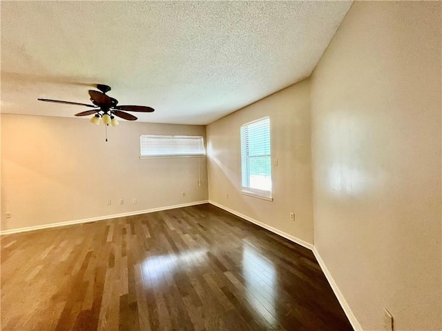 2811 Chatelain Ct Unit A, Independence, MO 64057 - empty room with wood finished floors, ceiling fan, and a textured ceiling