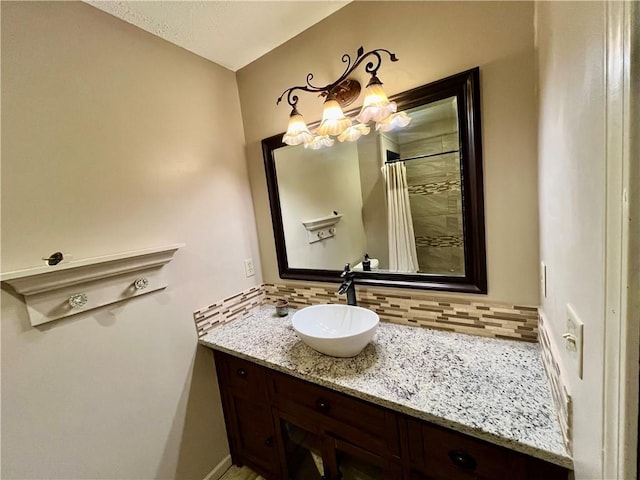 2811 Chatelain Ct Unit A, Independence, MO 64057 - full bathroom with decorative backsplash, vanity, tiled shower, and a chandelier