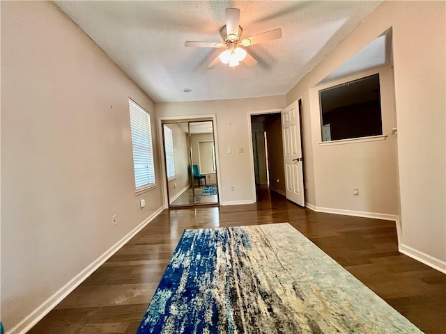2811 Chatelain Ct Unit A, Independence, MO 64057 - bedroom with wood finished floors, a closet, ceiling fan, and a textured ceiling