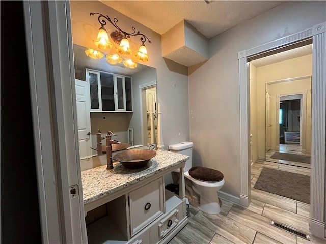 2811 Chatelain Ct Unit A, Independence, MO 64057 - bathroom featuring vanity and a textured ceiling