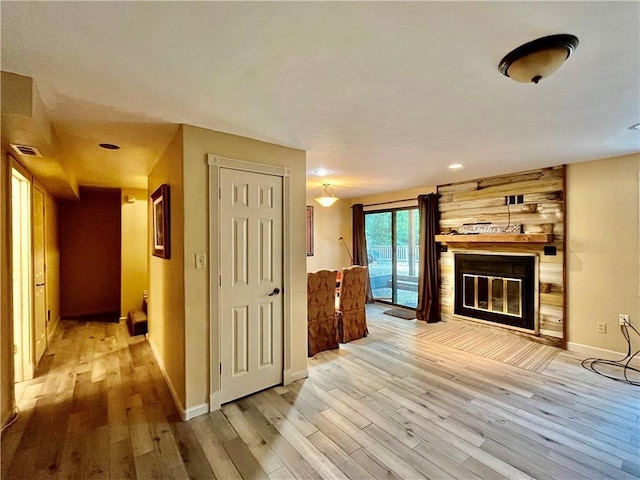 2811 Chatelain Ct Unit A, Independence, MO 64057 - unfurnished living room featuring wood finished floors and a large fireplace