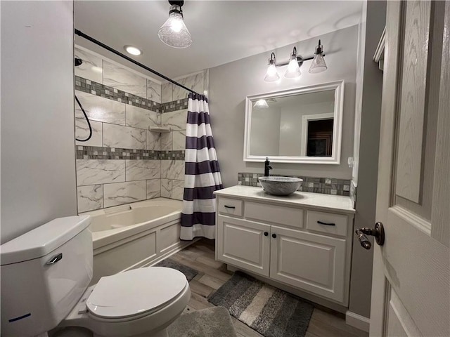 2811 Chatelain Ct Unit A, Independence, MO 64057 - bathroom featuring vanity, shower / bath combo with shower curtain, and wood finished floors