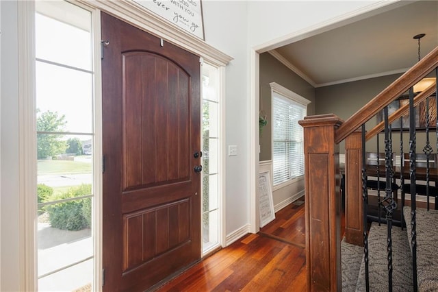3132 SW Damon Ln, Lees Summit, MO 64082 - foyer entrance with dark wood finished floors, crown molding, and stairway