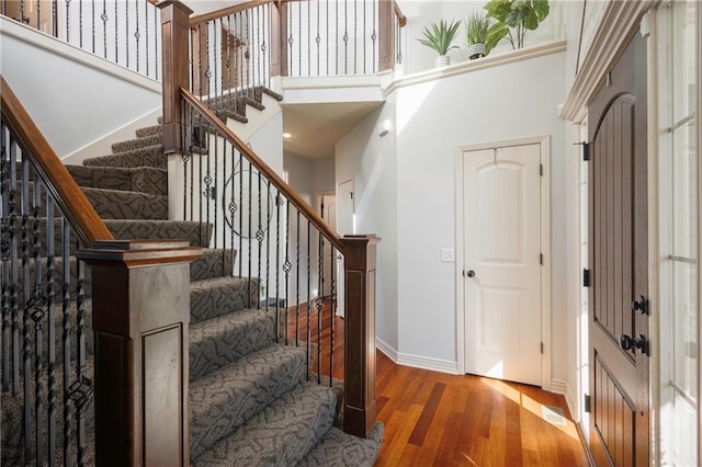 3132 SW Damon Ln, Lees Summit, MO 64082 - entrance foyer with wood finished floors, stairway, and a high ceiling