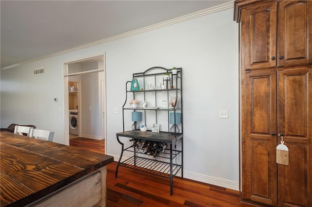 3132 SW Damon Ln, Lees Summit, MO 64082 - dining space featuring washer / dryer, crown molding, and wood finished floors