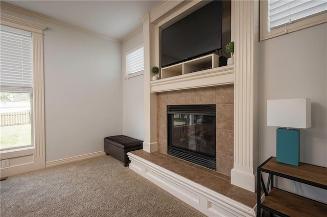 3132 SW Damon Ln, Lees Summit, MO 64082 - unfurnished living room with ornamental molding, carpet flooring, a fireplace, and healthy amount of natural light