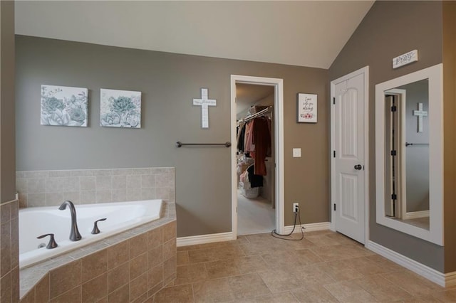 3132 SW Damon Ln, Lees Summit, MO 64082 - bathroom with a bath, lofted ceiling, and a spacious closet