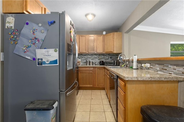 2712 S 52nd St, Kansas City, KS 66106 - kitchen with stainless steel appliances, tasteful backsplash, a peninsula, ornamental molding, and a textured ceiling