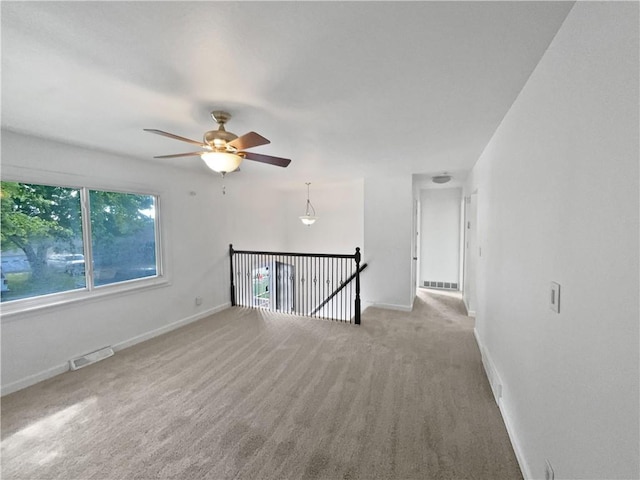 1208 Ranson Pl, Independence, MO 64057 - empty room featuring carpet flooring and ceiling fan