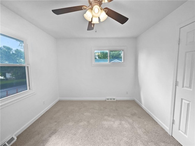 1208 Ranson Pl, Independence, MO 64057 - spare room with carpet and a ceiling fan