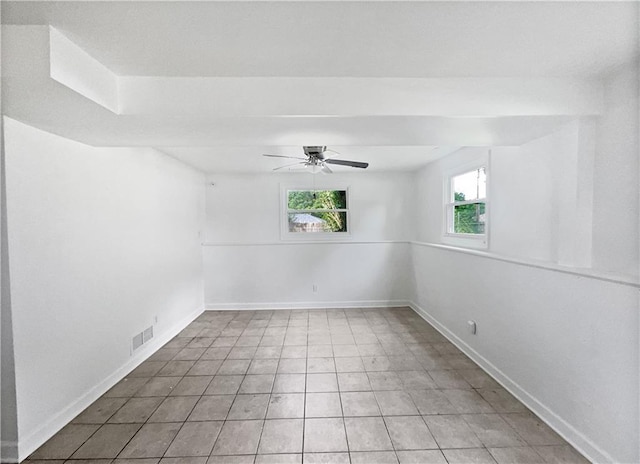 1208 Ranson Pl, Independence, MO 64057 - tiled spare room with a ceiling fan and baseboards