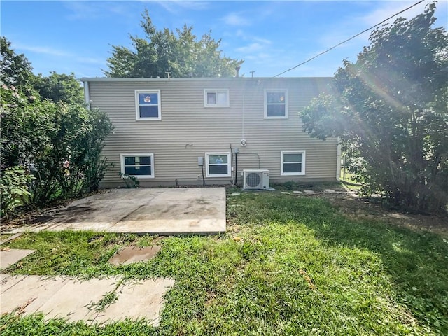 1208 Ranson Pl, Independence, MO 64057 - back of property with a lawn and a patio