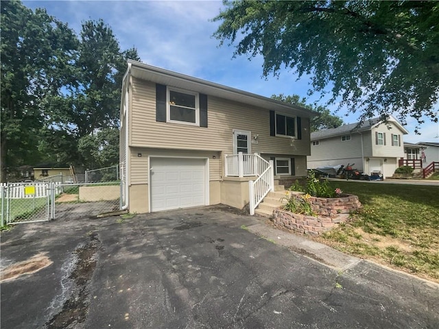 1208 Ranson Pl, Independence, MO 64057 - raised ranch featuring driveway and a garage