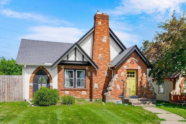 7101 Harrison St, Kansas City, MO 64131 - english style home with brick siding, a chimney, and a shingled roof