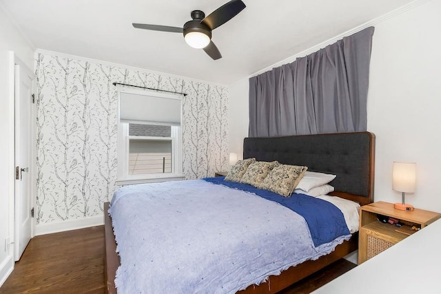 7101 Harrison St, Kansas City, MO 64131 - bedroom featuring wood finished floors, wallpapered walls, ceiling fan, and ornamental molding