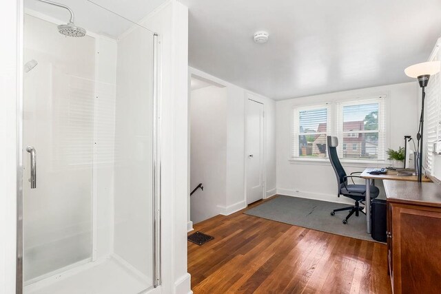 7101 Harrison St, Kansas City, MO 64131 - home office featuring dark wood-style floors and baseboards