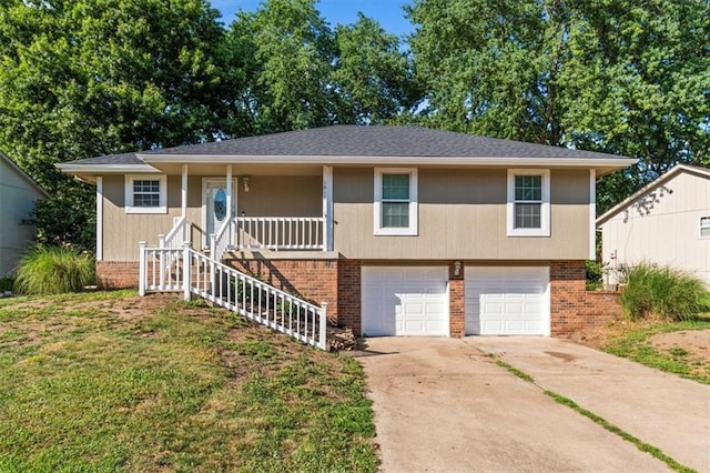 1916 NE Patterson Dr, Lees Summit, MO 64086 - view of front of property with an attached garage, driveway, brick siding, a porch, and stairs
