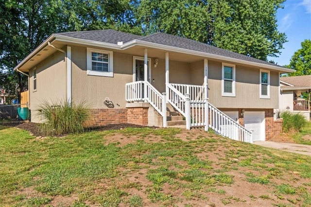 1916 NE Patterson Dr, Lees Summit, MO 64086 - ranch-style house featuring driveway, an attached garage, covered porch, a front yard, and brick siding