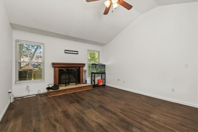 1916 NE Patterson Dr, Lees Summit, MO 64086 - unfurnished living room featuring lofted ceiling, ceiling fan, a fireplace with raised hearth, and wood finished floors