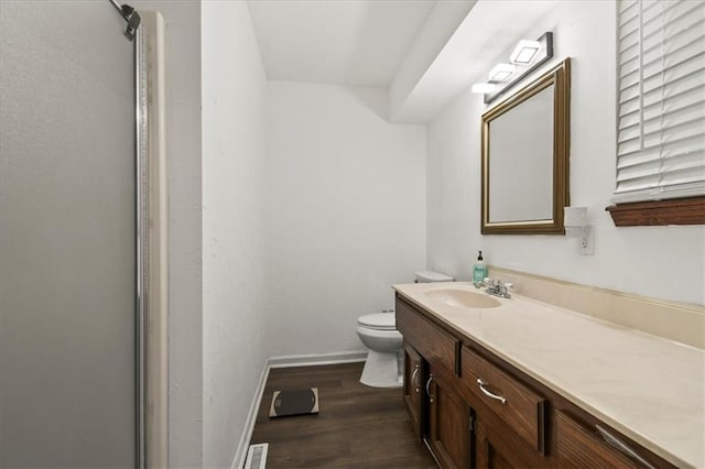 1916 NE Patterson Dr, Lees Summit, MO 64086 - full bath with vanity, wood finished floors, and a shower