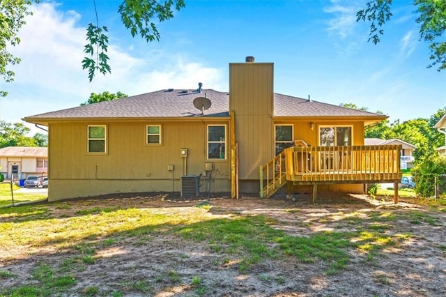 1916 NE Patterson Dr, Lees Summit, MO 64086 - back of property with a wooden deck and a chimney