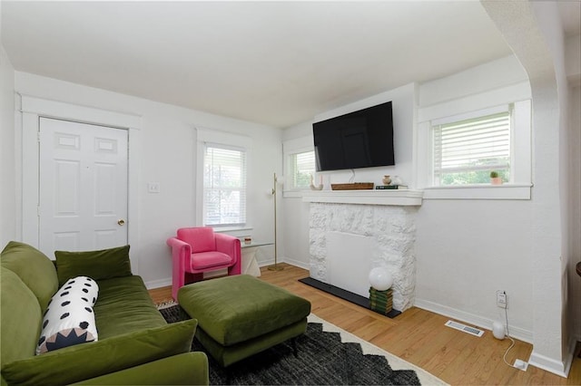 4206 Mission Rd, Kansas City, KS 66103 - living room with wood finished floors and a fireplace
