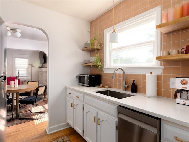 4206 Mission Rd, Kansas City, KS 66103 - kitchen featuring open shelves, stainless steel appliances, plenty of natural light, and white cabinets