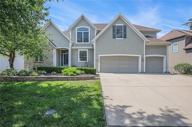 14622 S Garnett St, Olathe, KS 66062 - traditional-style home with driveway, a front lawn, stucco siding, and an attached garage