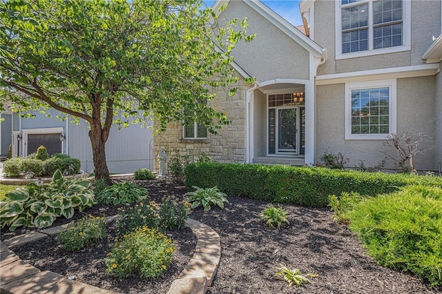 14622 S Garnett St, Olathe, KS 66062 - view of exterior entry featuring stone siding and stucco siding