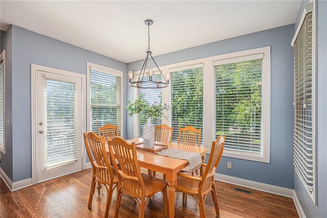 14622 S Garnett St, Olathe, KS 66062 - dining room featuring a chandelier and wood finished floors