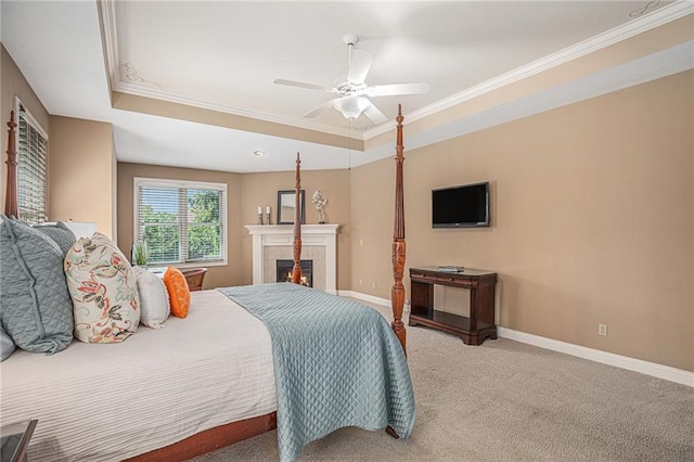 14622 S Garnett St, Olathe, KS 66062 - carpeted bedroom featuring a raised ceiling, crown molding, a fireplace, and ceiling fan
