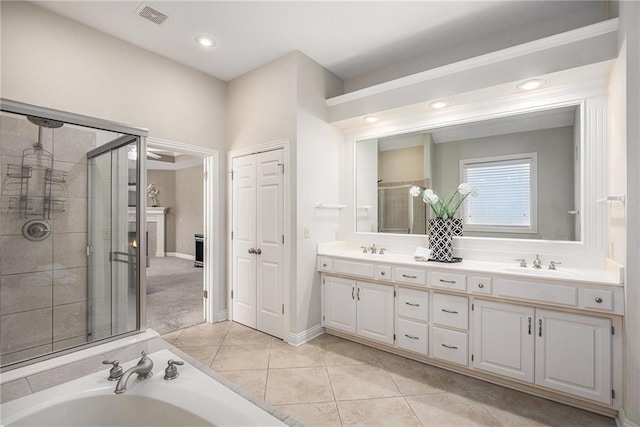 14622 S Garnett St, Olathe, KS 66062 - full bath featuring double vanity, a stall shower, tile patterned flooring, a garden tub, and recessed lighting