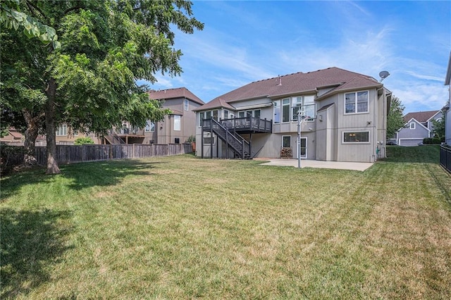 14622 S Garnett St, Olathe, KS 66062 - back of property with a patio, stairway, and a wooden deck