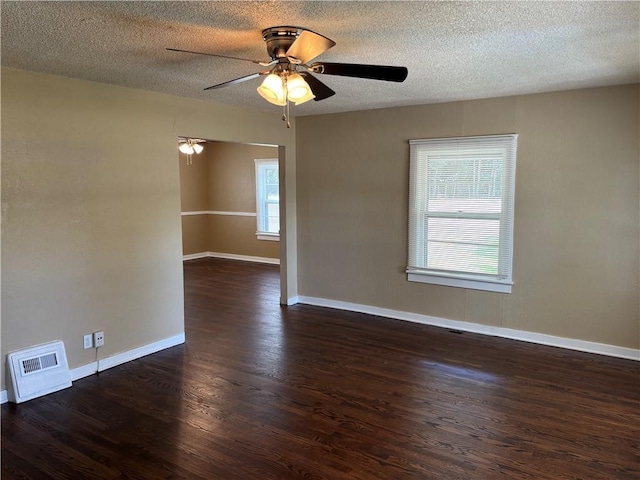 4202 Dr Greaves Rd, Grandview, MO 64030 - unfurnished room featuring wood finished floors, ceiling fan, and a textured ceiling