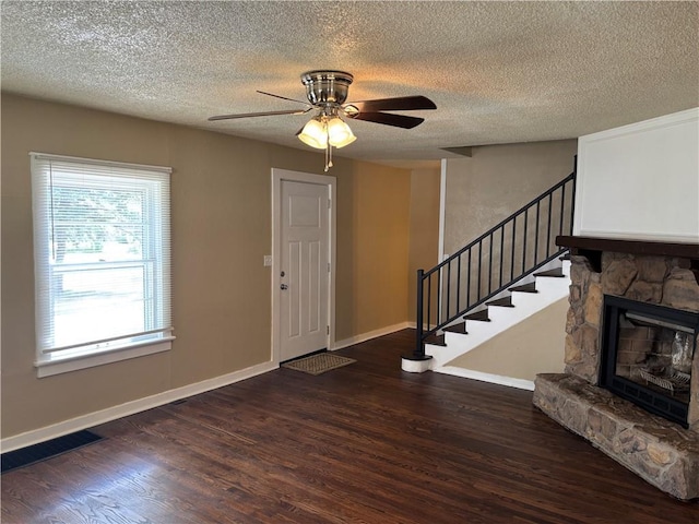 4202 Dr Greaves Rd, Grandview, MO 64030 - foyer entrance with wood finished floors, stairs, ceiling fan, and a textured ceiling