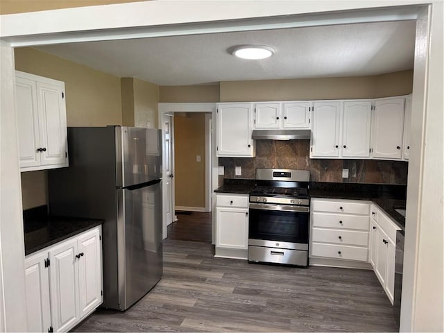 4202 Dr Greaves Rd, Grandview, MO 64030 - kitchen featuring appliances with stainless steel finishes, dark countertops, and white cabinets