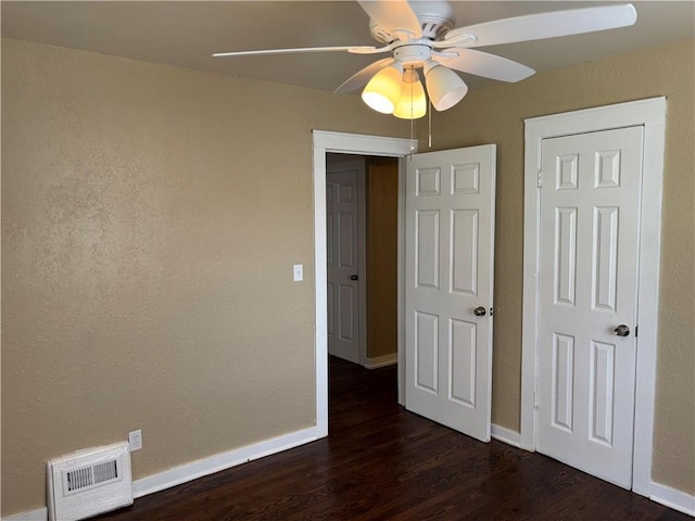4202 Dr Greaves Rd, Grandview, MO 64030 - unfurnished bedroom with dark wood-style flooring and ceiling fan