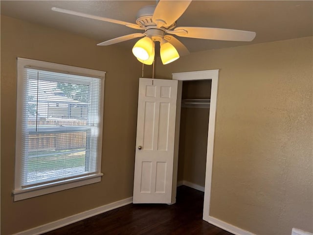 4202 Dr Greaves Rd, Grandview, MO 64030 - unfurnished bedroom featuring dark wood-type flooring, a closet, and ceiling fan