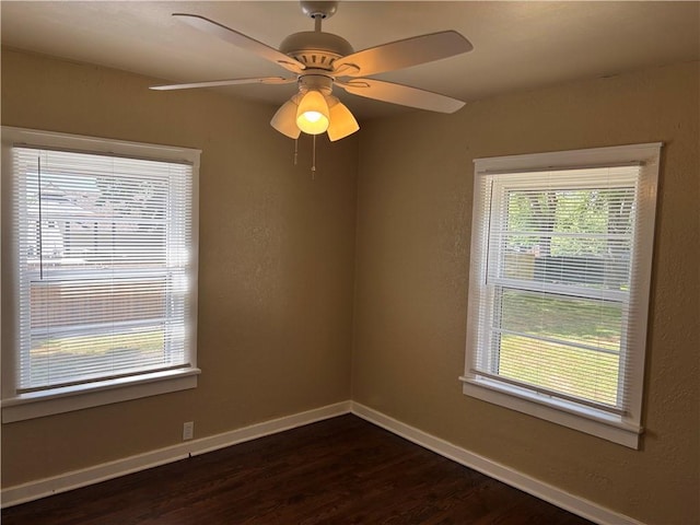 4202 Dr Greaves Rd, Grandview, MO 64030 - spare room with dark wood-style floors and ceiling fan