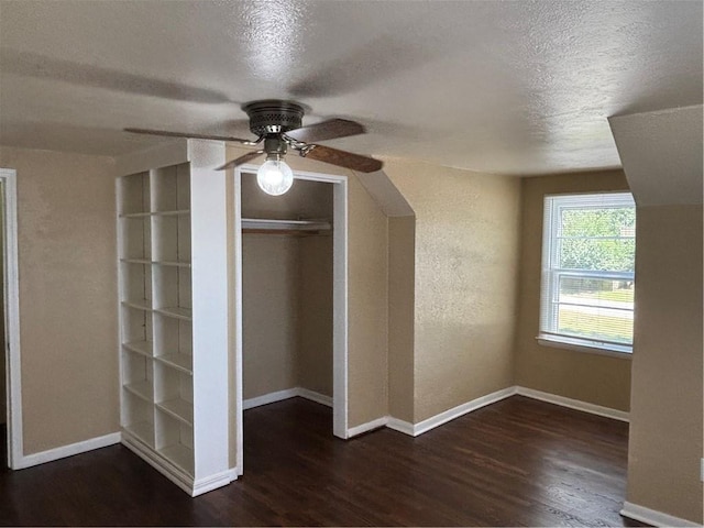 4202 Dr Greaves Rd, Grandview, MO 64030 - additional living space featuring wood finished floors, a textured ceiling, and a ceiling fan
